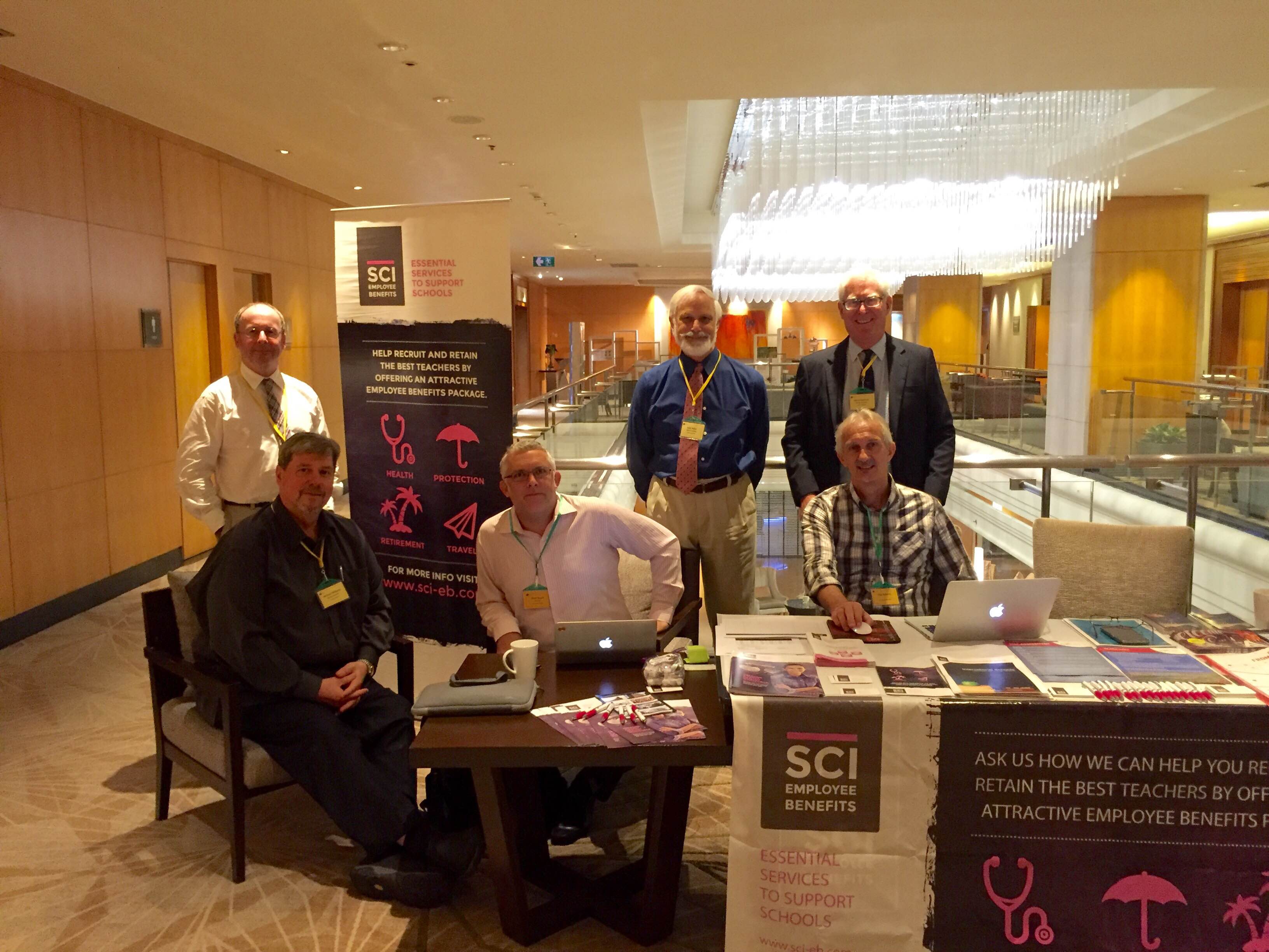 Senior Associates Michael Williams, John Ritter, and Harry Deelman with Gavin Snook and Clive Roberts from SCI Employee Benefits, one of our fair sponsors.